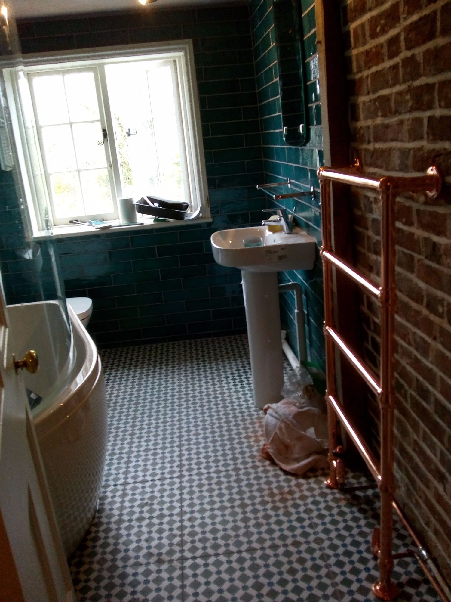 wall and floor tiling in bathroom